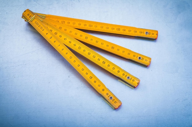 Horizontal version of wooden meter on metallic background construction concept