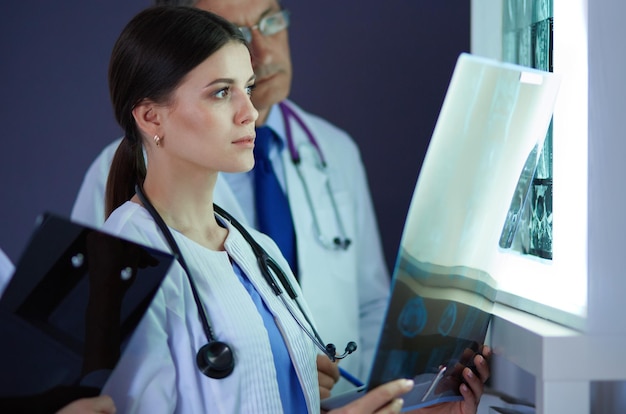 Hospital doctors looking at xrays in an emergency room