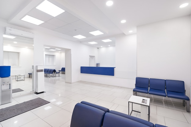 Hospital waiting room with empty chairs.