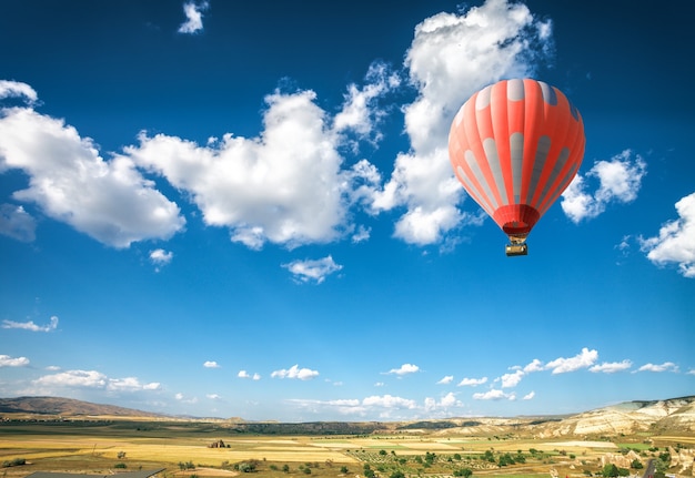 Hot air balloon flying over spectacular Cappadocia