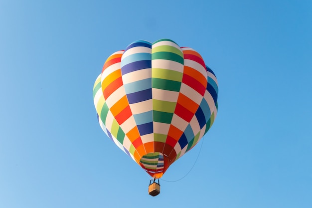 Hot air balloons flying in blue sky