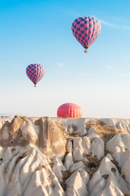 Hot air balloons flying over Cappadocia