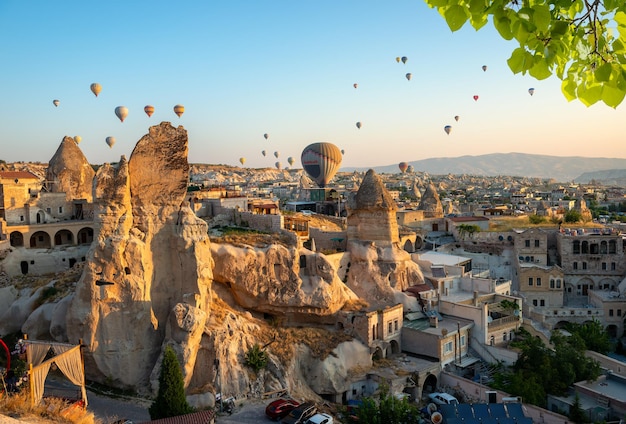 Hot air balloons over rocks