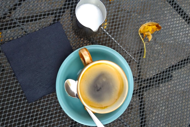 hot black coffee or Americano in blue ceramic cup top view