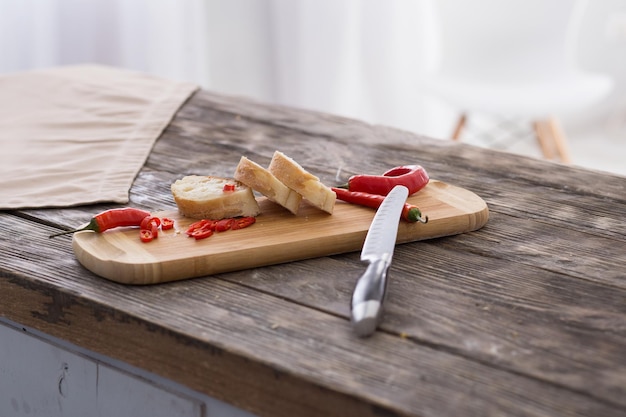 Hot chili peppers on cutting board