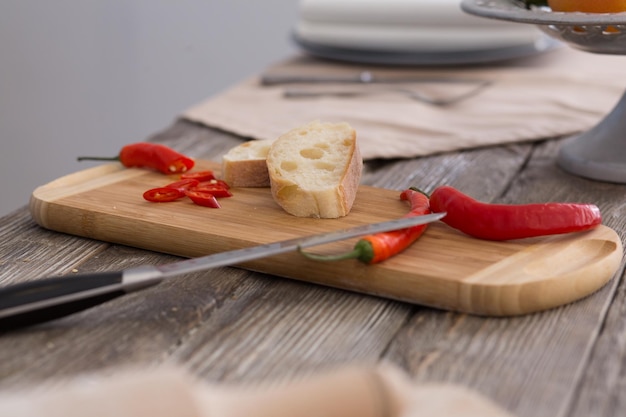 Hot chili peppers on cutting board