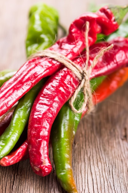 Hot chilli pepper on wooden background