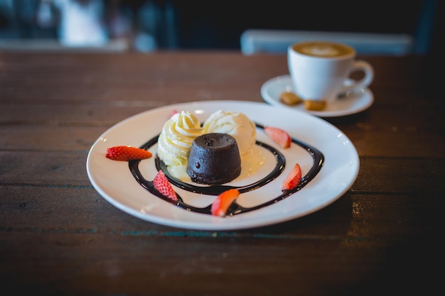 Hot chocolate lava cake with vanilla ice cream and fresh strawberry