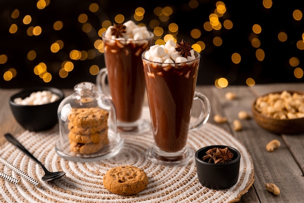 Hot chocolate with marshmallow on wooden table with copy space