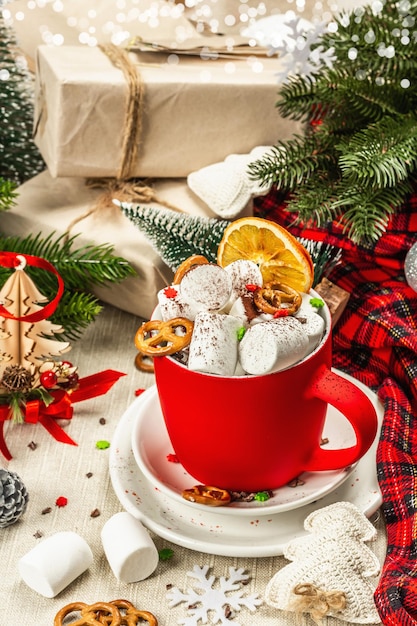 Hot cocoa or chocolate with marshmallows. Christmas traditional decor, New Year festive arrangement. The concept of coziness and good mood, close up