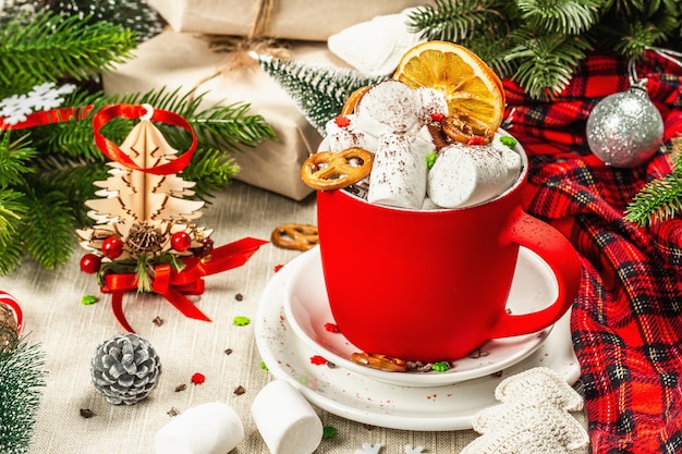 Hot cocoa or chocolate with marshmallows. Christmas traditional decor, New Year festive arrangement. The concept of coziness and good mood, close up