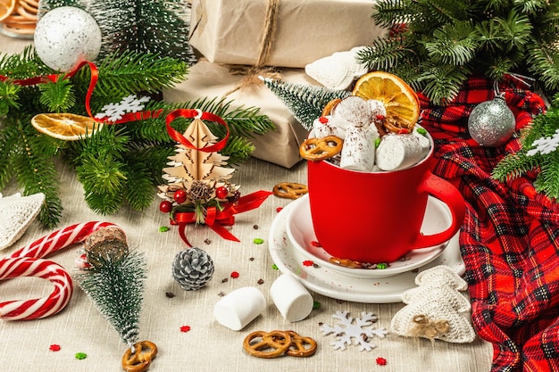 Hot cocoa or chocolate with marshmallows. Christmas traditional decor, New Year festive arrangement. The concept of coziness and good mood, copy space