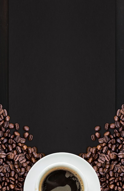 Hot coffee and bean on wooden background. top view