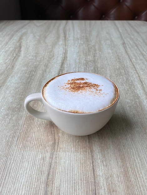 Hot coffee cup on table in cafe