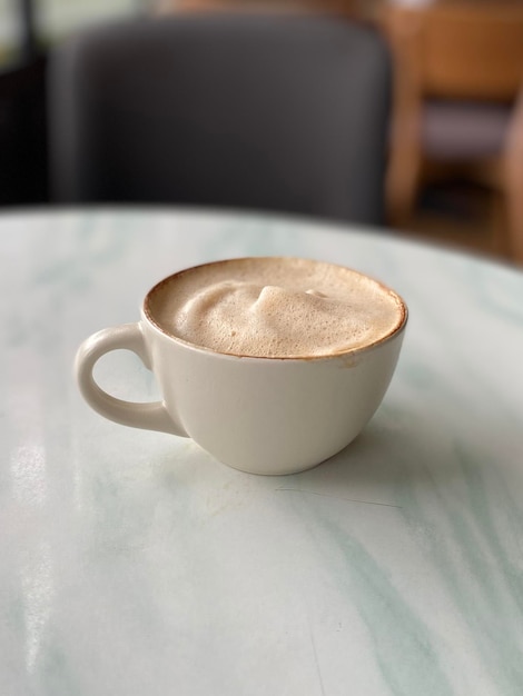 Hot coffee cup on table