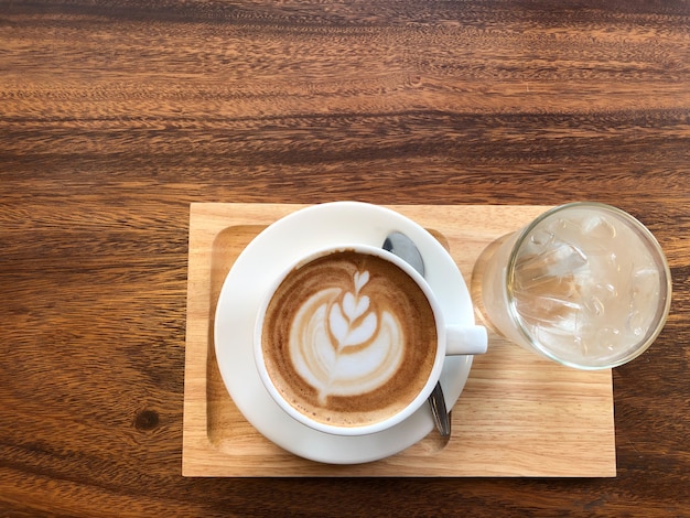 Hot coffee in a cup with milk foam