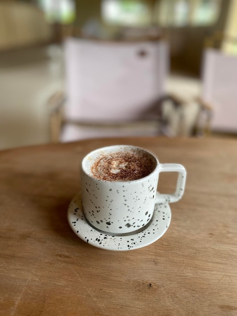 Hot coffee cup on wooden table