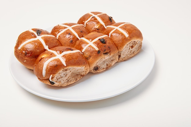 Hot cross bun on white background