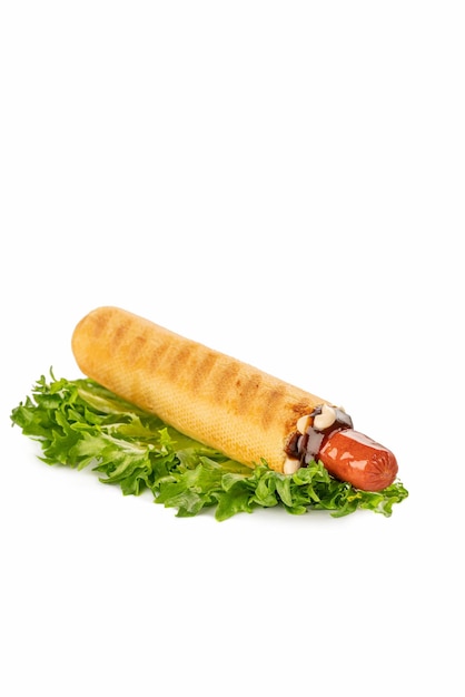 Hot dog on a white isolated background fried sausage in sauce