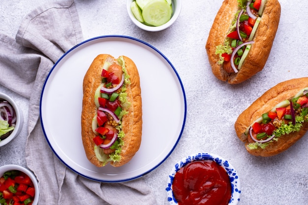 Hot dogs with sausage sauces and vegetables