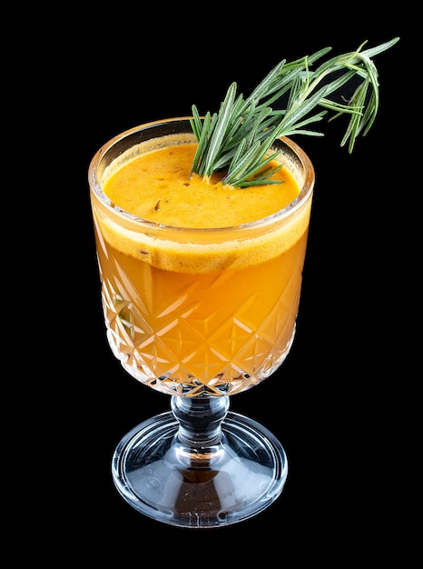 Hot drink with sea buckthorn and rosemary On dark background