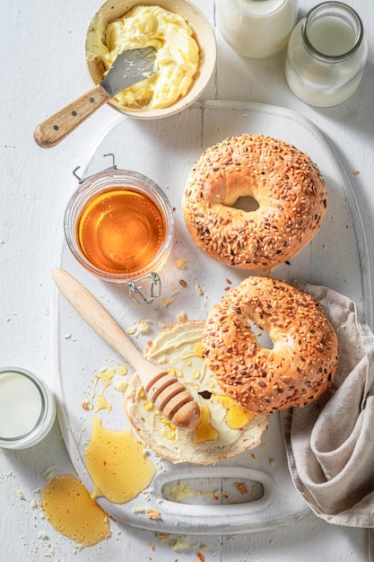 Hot and fresh golden bagels with milk and honey