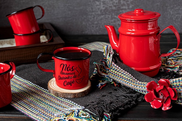 Hot freshly brewed coffee served in a red coffee set