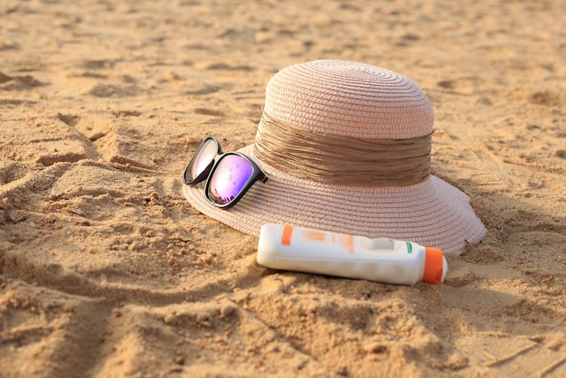 hot and glasses on the sand in sea