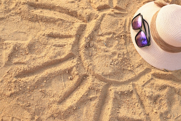 hot and glasses on the sand in sea