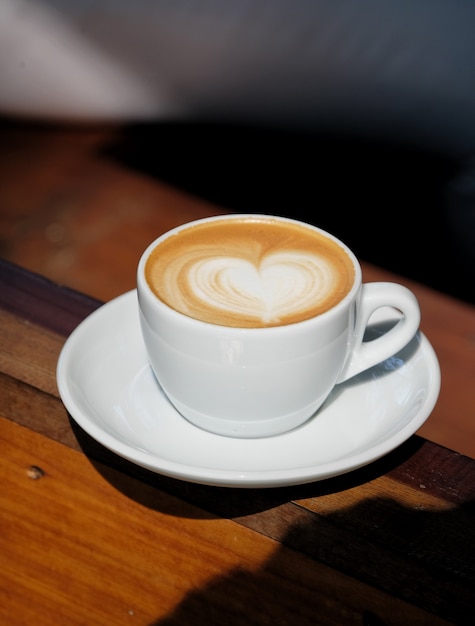 Hot latte art coffee in white mug