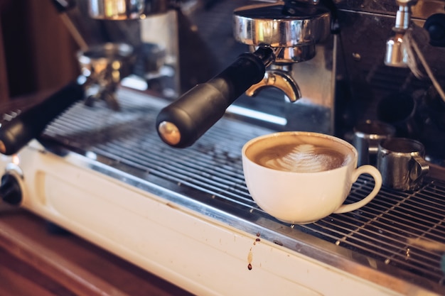 Hot Latte coffee leaf shape on coffee maker bar