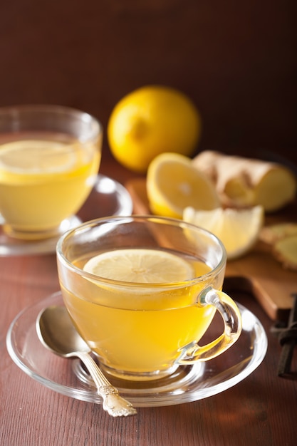 Hot lemon ginger tea in glass cup