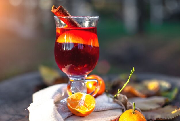 hot mulled wine in a glass Outdors picnic in autumn park Gluhwein hot wine