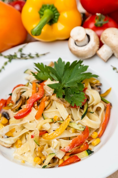 Hot pasta with garnish on plate