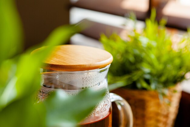 Hot refreshing citrus tea in glass close up