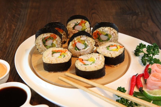 Hot roll set sashimi japanese food on wooden background