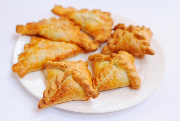 Hot samsa on a plate. Caucasian kitchen