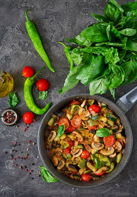 Hot spicy stew eggplant, sweet pepper, tomato, zucchini and mushrooms.