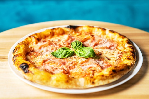 Hot tasty traditional italian pizza with ham