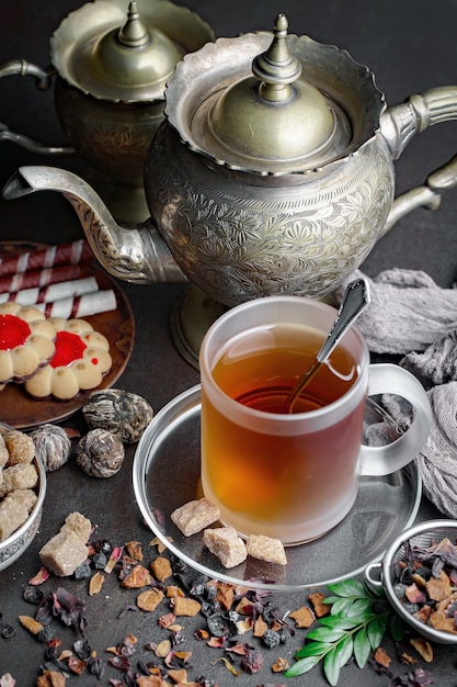 Hot tea in a cup on an old background