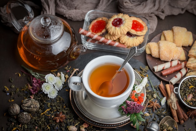 Hot tea in a cup on an old background.