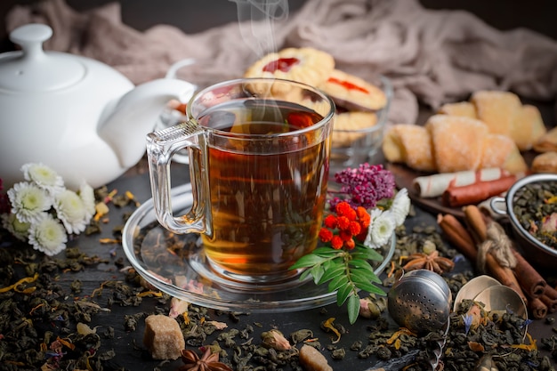 Hot tea in a cup on an old background