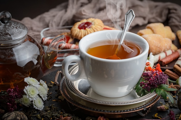 Hot tea in a cup on an old background