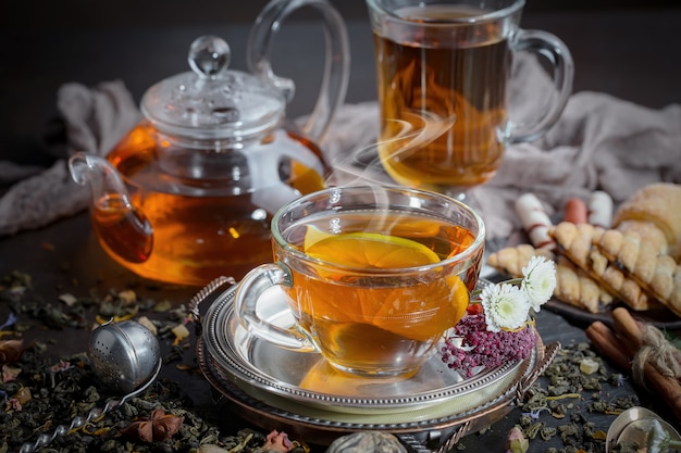 Hot tea in a cup on an old background