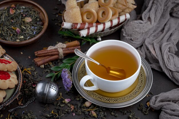 Hot tea in a cup on an old background