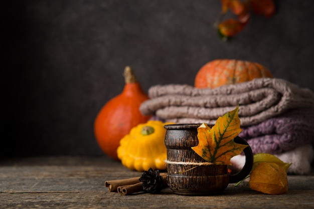 Hot tea cup with autumn decorations, Thanksgiving, autumn background, selective focus, copy space