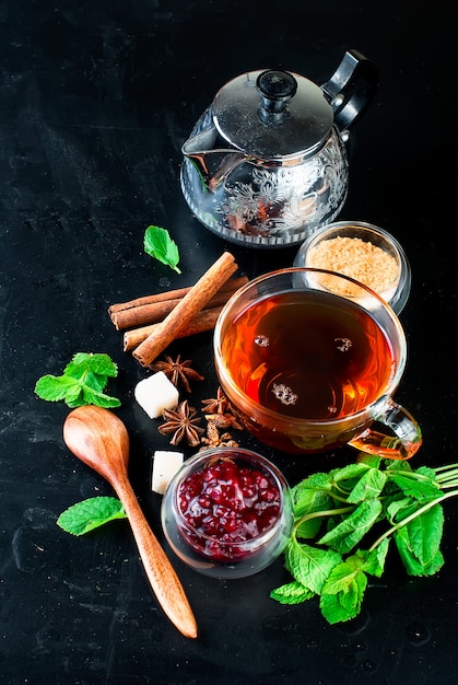 Hot tea with mint, lemon, mint and raspberry jam