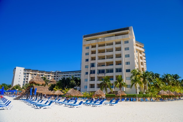 Hotel on the sandy beach on a sunny day in Cancun Yukatan Mexico