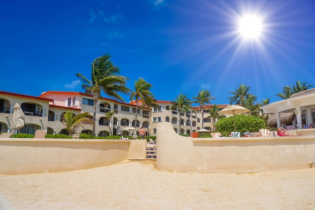 Hotel on a sandy beach on a sunny day in Playa del Carmen Mexico