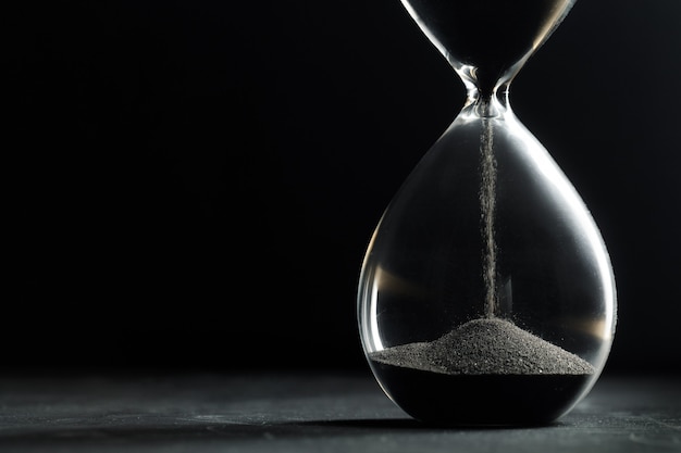 Hourglass on dark background